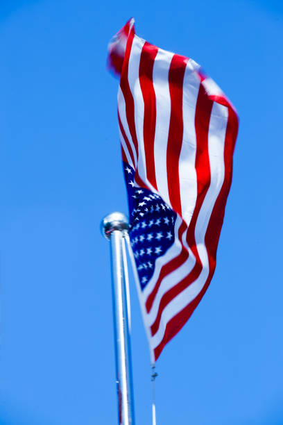 istock American Flag Blowing in the Wind 975608572