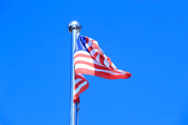 istock American Flag Blowing in the Wind 975608690