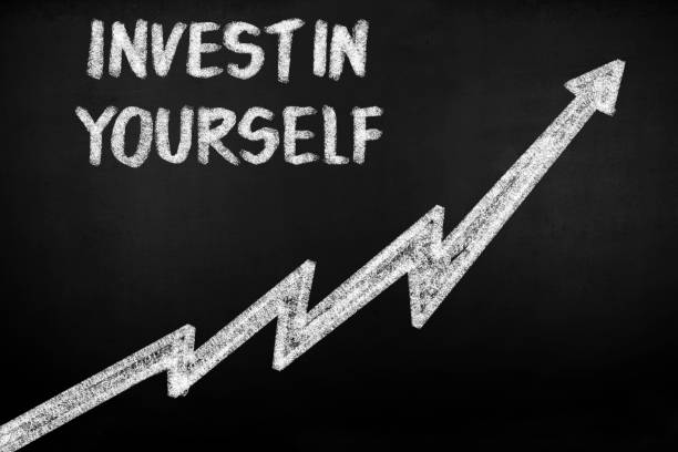 istock Invest In Yourself Drawn on Blackboard 975611846