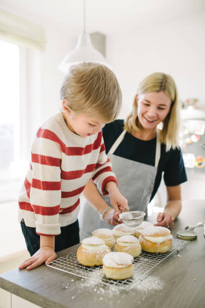 istock Mother and son making semla buns on Shrove Tuesday 975615604