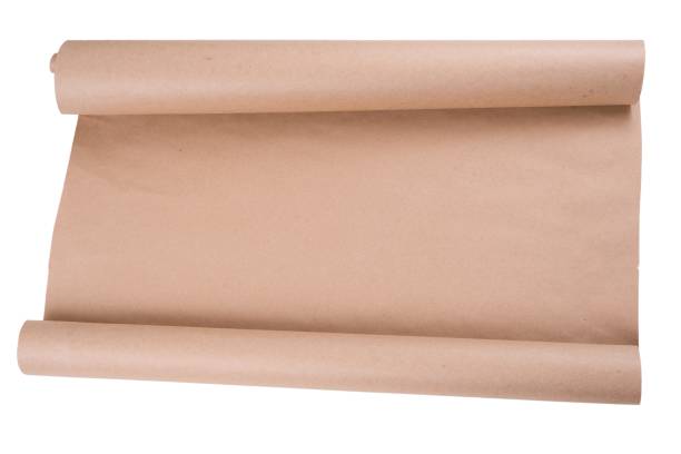 istock Isolated kraft paper on roll. Background, texture, copy space. 975620586
