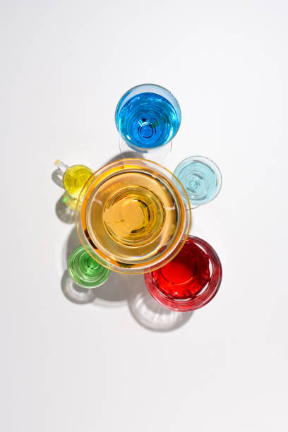 istock flat lay with various alcohol cocktails in glasses on white backdrop 975623608