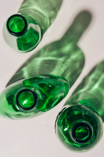 istock top view of green empty glass bottles arranged on white tabletop 975623894