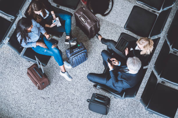 istock People with their suitcases from up above 975627816