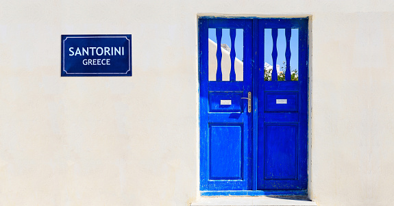 Santorini island, Greece, Blue door on a whitewashed wall