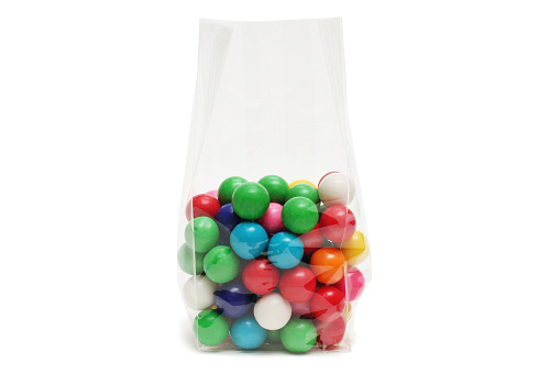 Cellophane bag for candy. White bag package template on isolated background.