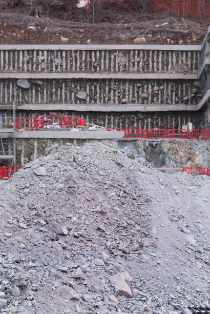 istock Part of foundation with mound of gray earth 975632592