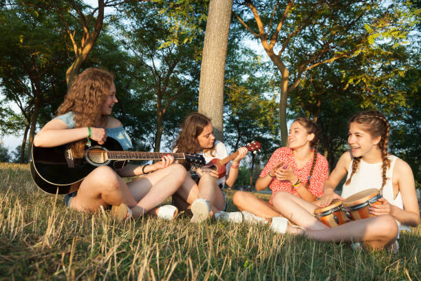 istock Young Band performing on the park 975637634