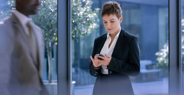 istock Businesswoman using smartphone 975638112