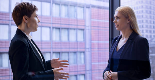 istock Businesswomen discussing in office 975638196