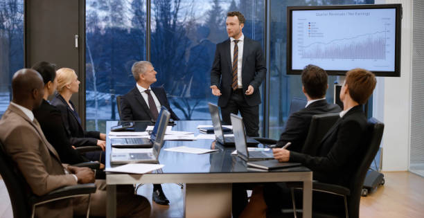 istock Business people having meeting in conference room 975638202