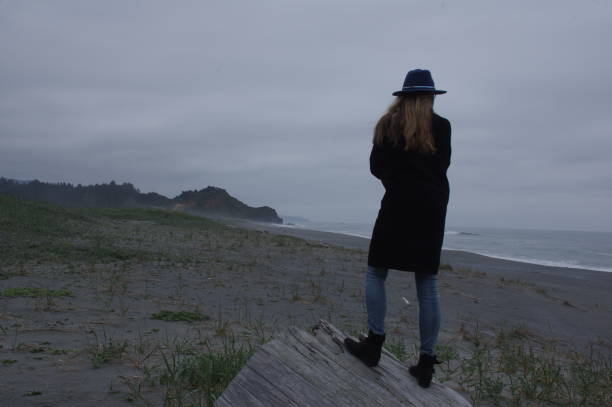 istock Woman watching the ocean 975652084