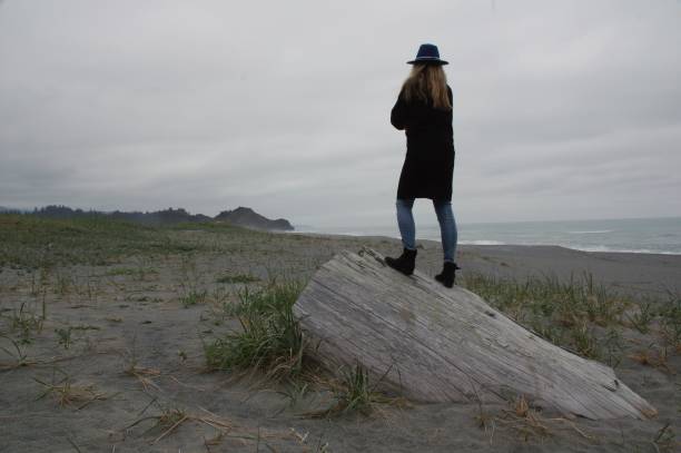 istock Woman watching the ocean 975653012