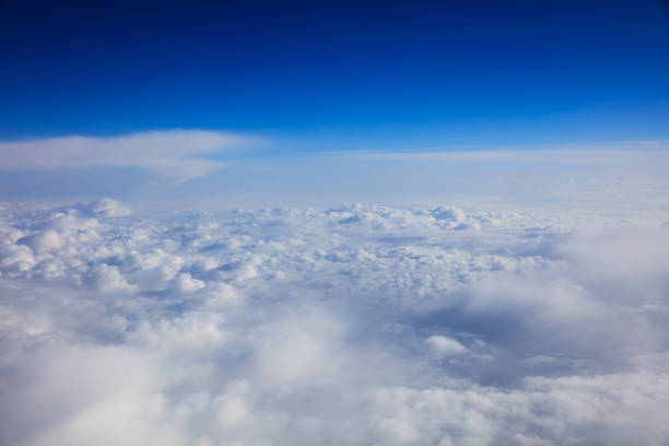 istock Beautiful view of clouds and sky from a plane window 975656480