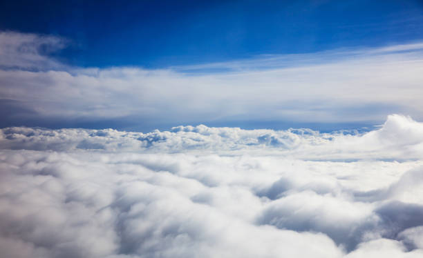 istock Beautiful view of clouds and sky from a plane window 975656842