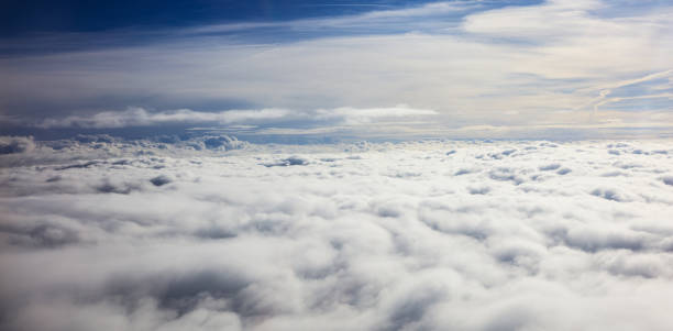 istock Beautiful view of clouds and sky from a plane window 975656932