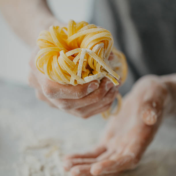 istock Chef making traditional italian homemade pasta 975658408