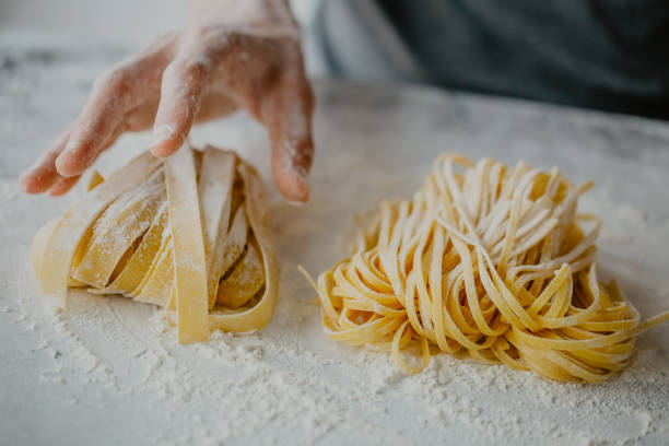 istock Chef making traditional italian homemade pasta 975658540