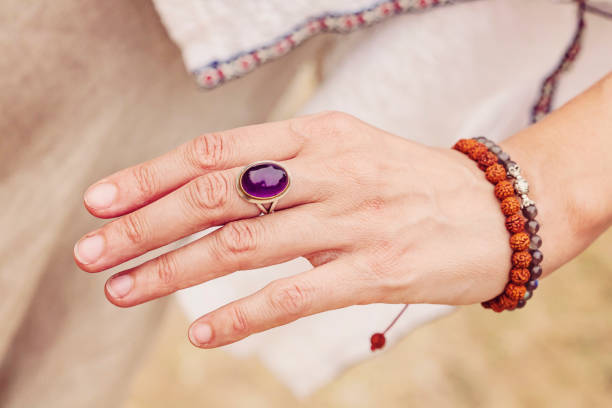 istock Female hand with Amethyst stone ring 975666970