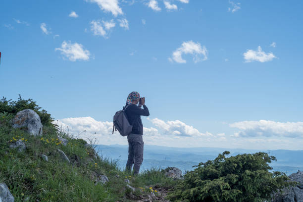 istock Photographer on mountain top 975670684