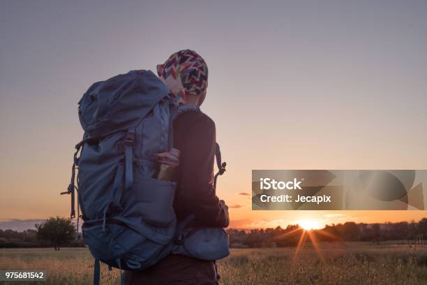 Hiker At Sunset Stock Photo - Download Image Now - Adult, Adults Only, Agricultural Field