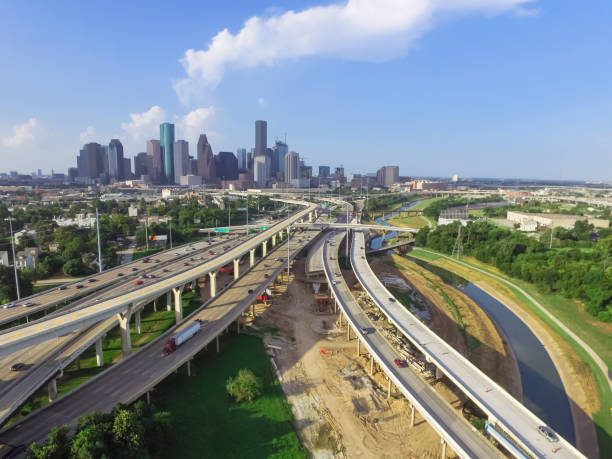 istock Downtown and interstate I45 highway flyover aerial 975685336