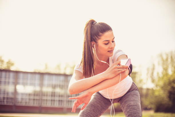 istock Smiling young woman exercise outside. 975688144
