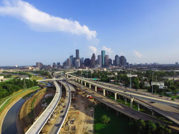 istock Downtown and interstate I45 highway flyover aerial 975688302