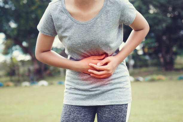 istock young woman having stomachache 975688970