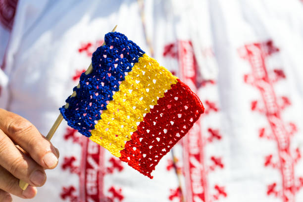 knitted romania flag with traditional romanian pattern background - romania flag romanian flag colors imagens e fotografias de stock