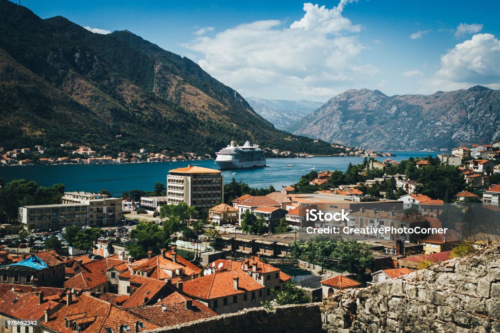 City of Kotor Aerial View of Kotor bay. Cruise ship docked in beautiful summer day. Cruise Ship Stock Photo