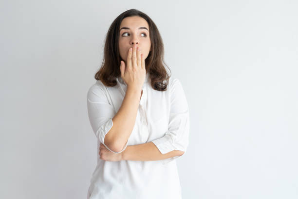 istock Amazed surprised girl learning secret and keeping silence 975698978