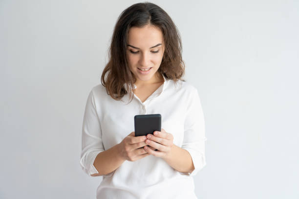 istock Focused girl communicating by smartphone 975699002