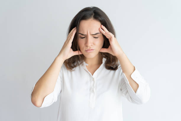 istock Frustrated tired girl suffering from headache 975699014