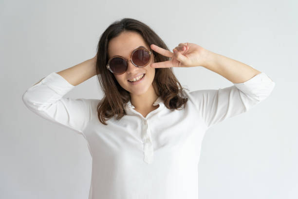 istock Joyful girl in sunglasses dancing and having fun 975699028
