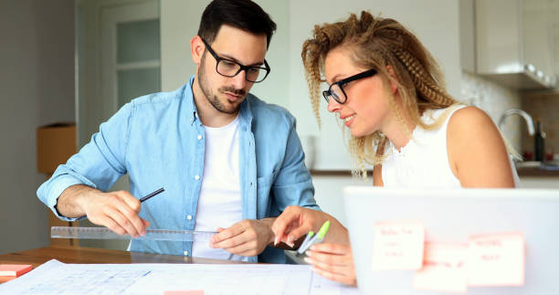 istock Businesspeople and architects planning 975701816