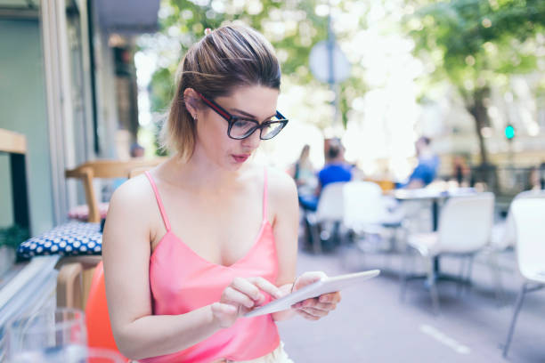 istock Young businesswoman with tablet 975701942