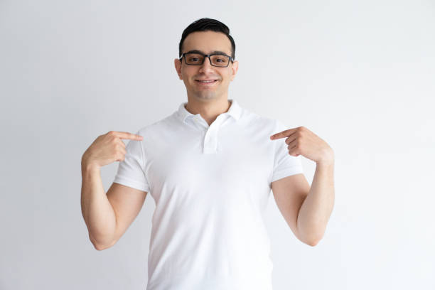 istock Proud young man pointing at himself and looking at camera 975705272