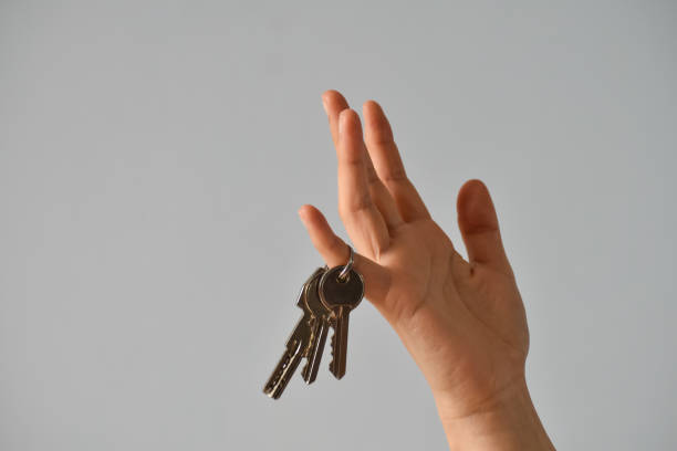 istock Hand (female) with a bunch of keys 975705410