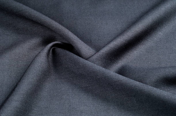 istock Background texture, pattern. cloth wool suit gray. A genuine flannel is always made of carded yarn, carded flannel is ideal in the cold months of the year, it is heavy, cozy and soft. 975707792