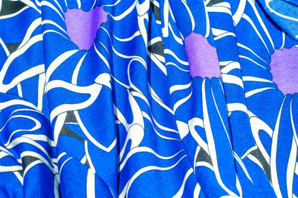 istock Texture, background, pattern. Women's blue silk dress. On an abstract illustration, white blue lilac tones 975707824