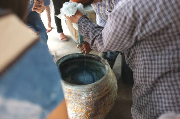 istock The process of indigo. Remove Indigo tree from the water. To use  Indigo cake 975708894