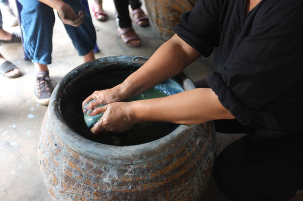istock The process of indigo. Remove Indigo tree from the water. To use  Indigo cake 975709434