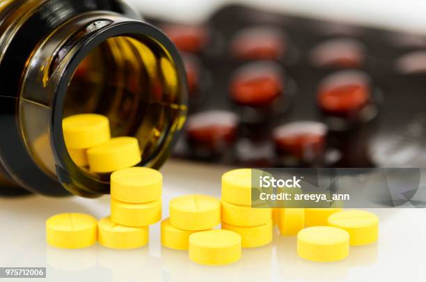Folic Acid Light Protected Strips And Amber Bottle Protect From Light Container With Medicine Stock Photo - Download Image Now