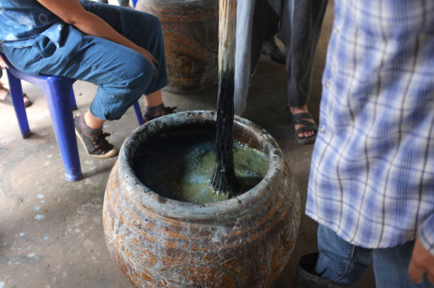 istock The process of indigo. Remove Indigo tree from the water. To use  Indigo cake 975712044
