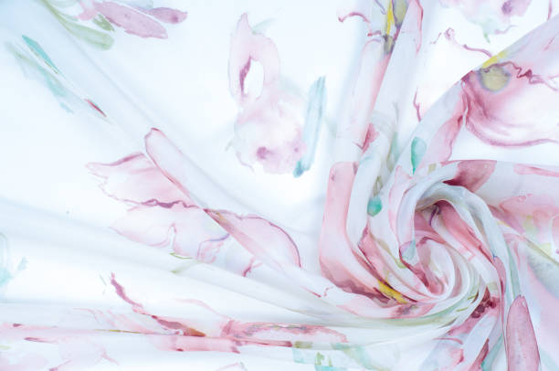 istock Fabric silk texture, painted with flowers 975712284