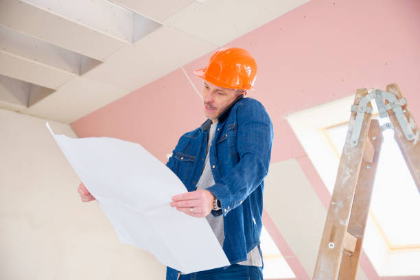 istock Construction worker consulting on his mobile phone 975712634