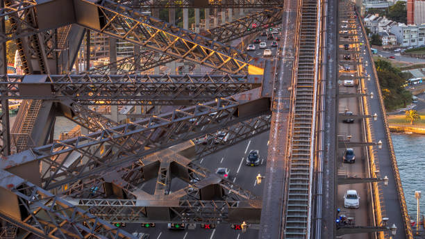 istock The sun is setting on the Sydney Harbour Bridge with the afternoon traffic. 975730326