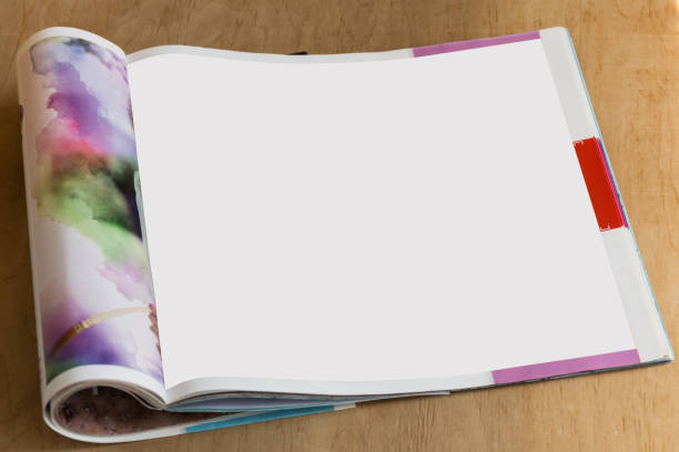 istock Blank glossy magazine on wooden background. 975730602