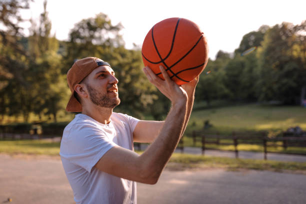 istock Young man playing basketball 975742446